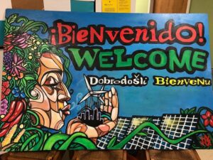 An abstract art YEBO bienvenido welcome mural.